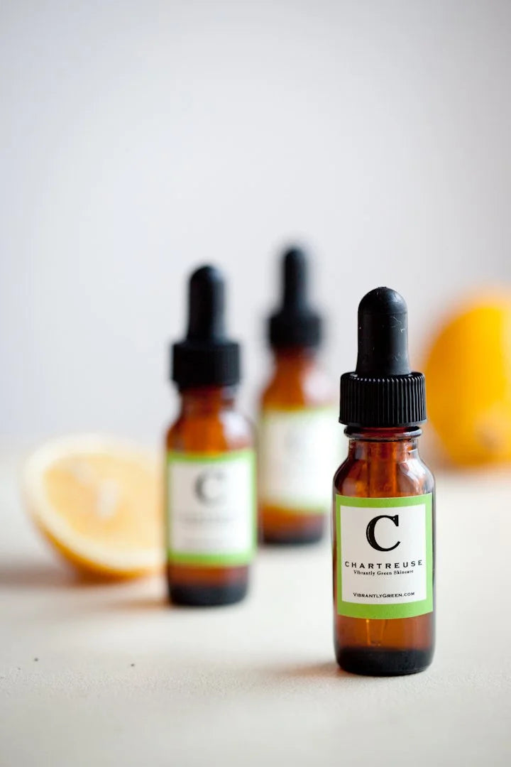 Daily C Serum in amber dropper bottles with fresh orange